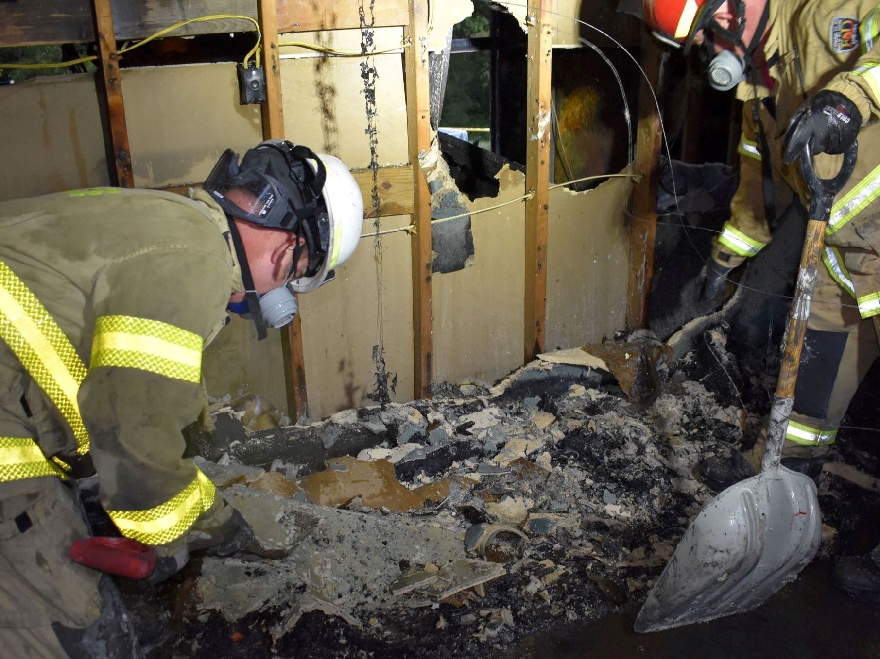 Fire Marshal digging during a fire investigation