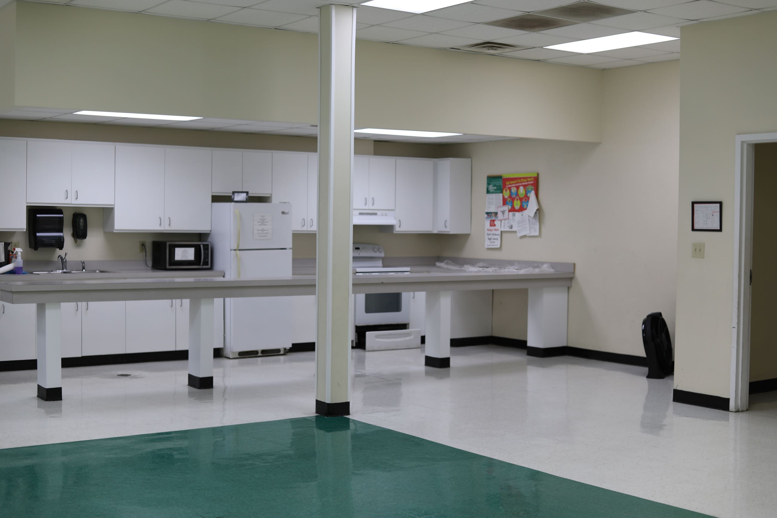 Old Armory Meeting Room Space with prep area, small kitchenette, and floor space